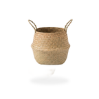 Woven seagrass belly basket on white