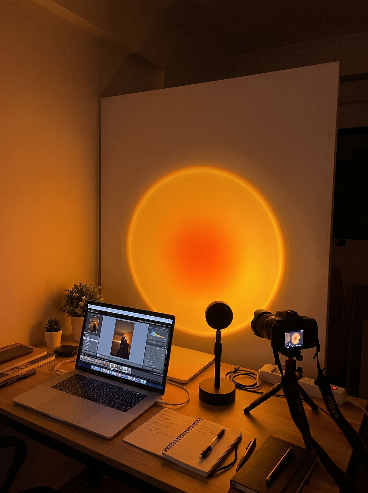 Sunset Projection Lamp lighting a creator's photo backdrop