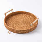Handwoven rattan tray basket on a pure white studio background