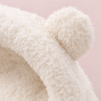 Close up of the fluffy plush and one bear ear